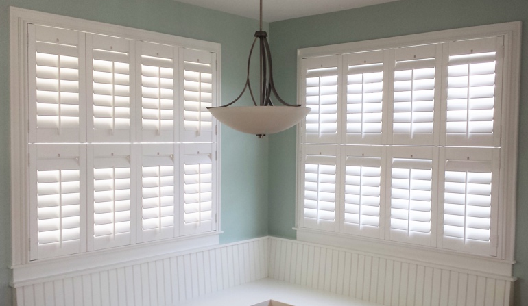 Soft green wall in St. George kitchen with shutters.